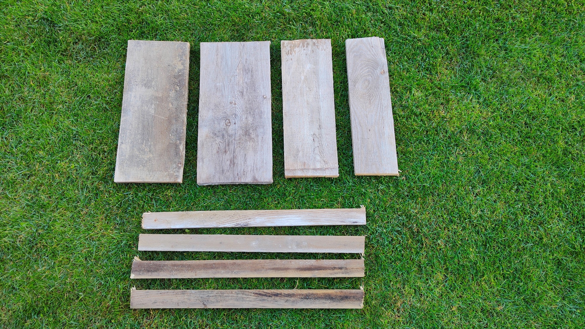 picture of wood laying on the grass